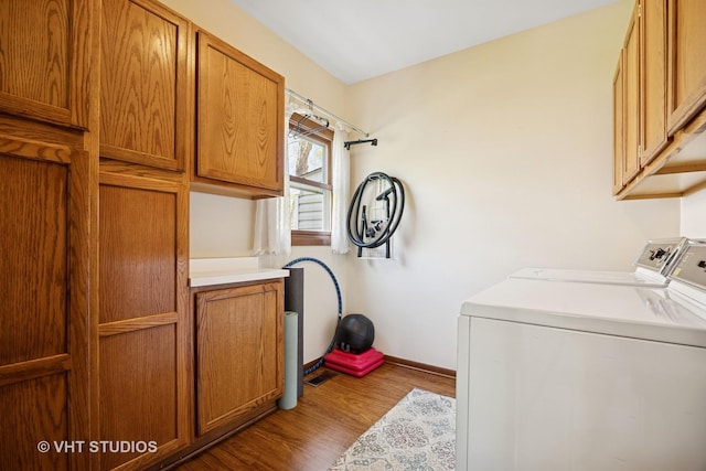 4230 Forest Glen Dr, Hoffman Estates, IL 60192 - laundry room featuring washer and clothes dryer, wood finished floors, cabinet space, and baseboards