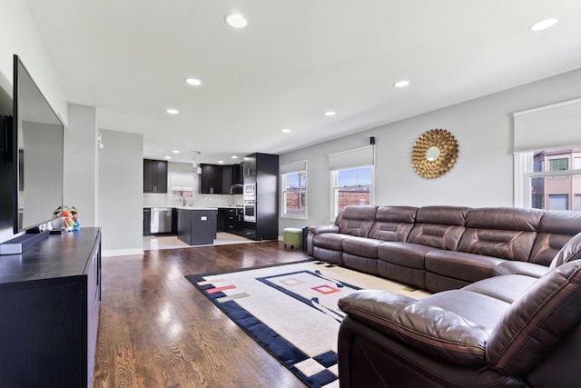 living room featuring recessed lighting and dark wood-style floors