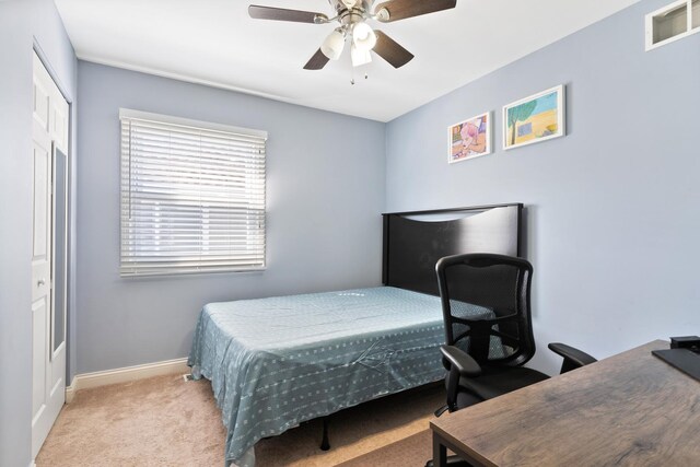 bedroom featuring carpet, a closet, a ceiling fan, visible vents, and baseboards