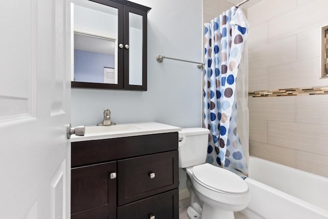 full bath featuring shower / bath combo, vanity, and toilet