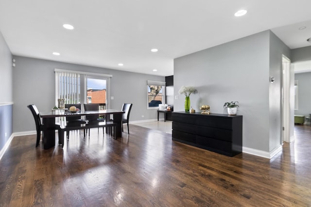 dining space with baseboards, recessed lighting, and wood finished floors