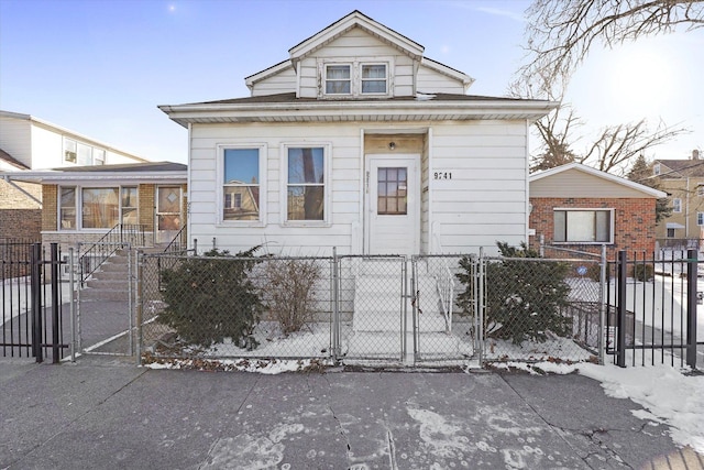 9241 S Blackstone Ave, Chicago, IL 60619 - view of front facade featuring a fenced front yard and a gate