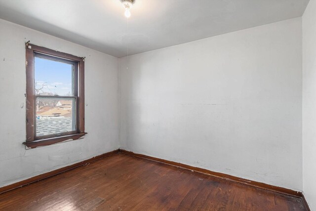 9241 S Blackstone Ave, Chicago, IL 60619 - spare room featuring dark wood-style floors