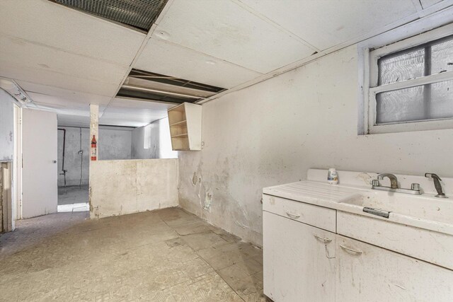 9241 S Blackstone Ave, Chicago, IL 60619 - unfinished below grade area with visible vents and a sink