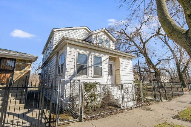 9241 S Blackstone Ave, Chicago, IL 60619 - view of front of house with a gate and a fenced front yard