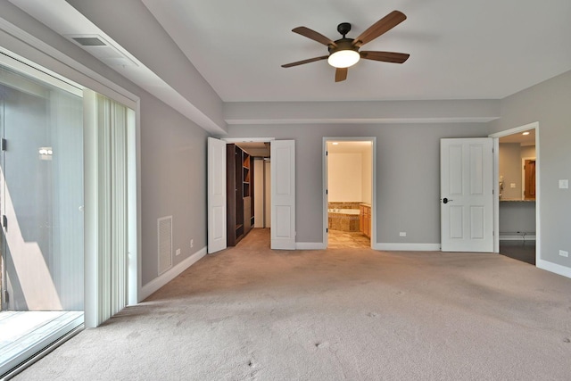 7420 W Lawrence Ave Unit 402, Harwood Heights, IL 60706 - unfurnished bedroom featuring baseboards, light carpet, a walk in closet, and ensuite bath