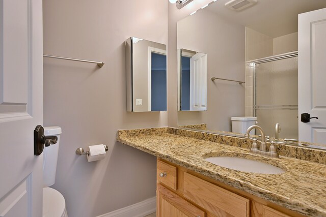 7420 W Lawrence Ave Unit 402, Harwood Heights, IL 60706 - bathroom with toilet, an enclosed shower, vanity, and baseboards