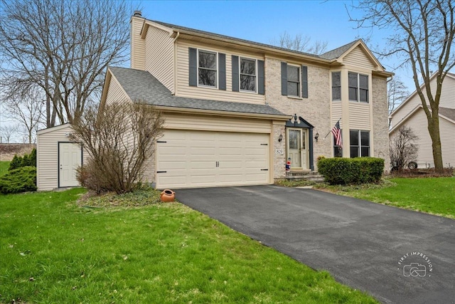 view of front of home featuring a chimney, aphalt driveway, a garage, and a front yard