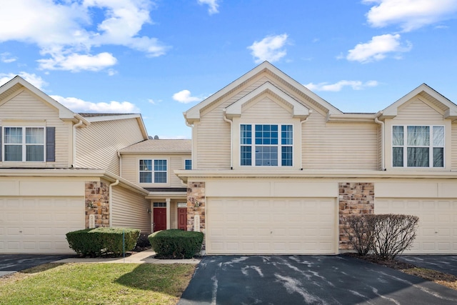 2366 Georgetown Cir, Aurora, IL 60503 - view of front of house featuring stone siding, a garage, and aphalt driveway