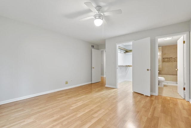 407 Brad Ct, Naperville, IL 60565 - unfurnished bedroom with light wood-style floors, a closet, a spacious closet, ensuite bath, and baseboards