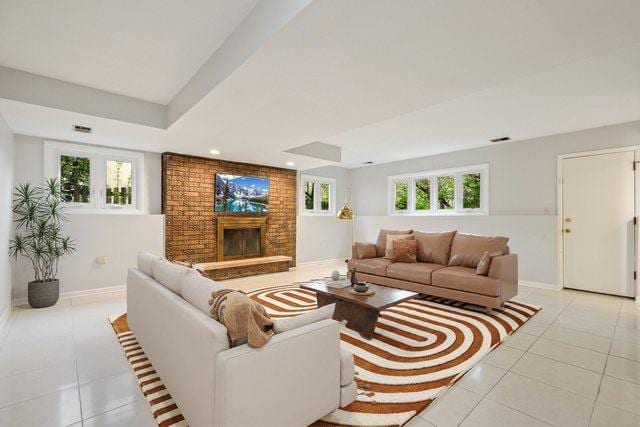 407 Brad Ct, Naperville, IL 60565 - living room featuring light tile patterned flooring, baseboards, recessed lighting, a fireplace, and a raised ceiling