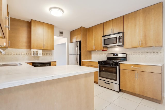 407 Brad Ct, Naperville, IL 60565 - kitchen with appliances with stainless steel finishes, a sink, decorative backsplash, and light tile patterned floors