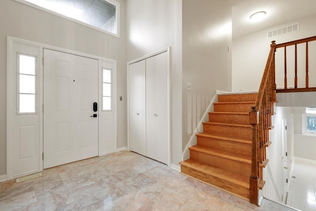 407 Brad Ct, Naperville, IL 60565 - entrance foyer featuring stairs, plenty of natural light, and a towering ceiling
