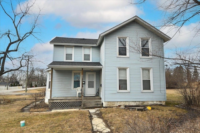 view of front of home with covered porch and roof with shingles