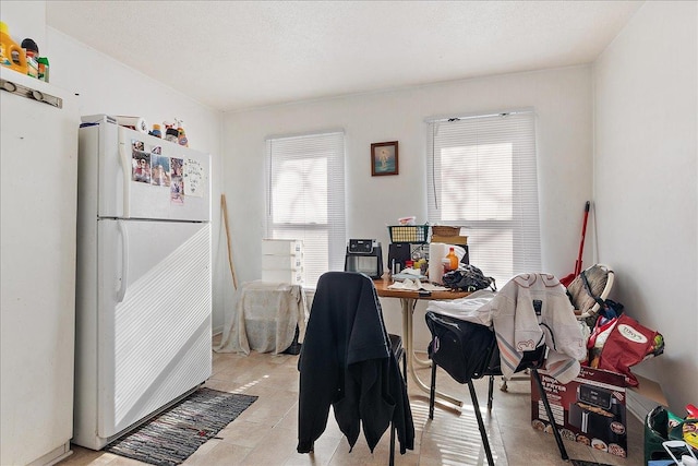 home office featuring a textured ceiling and a wealth of natural light