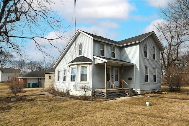 view of front of home with covered porch, a front lawn, and roof with shingles