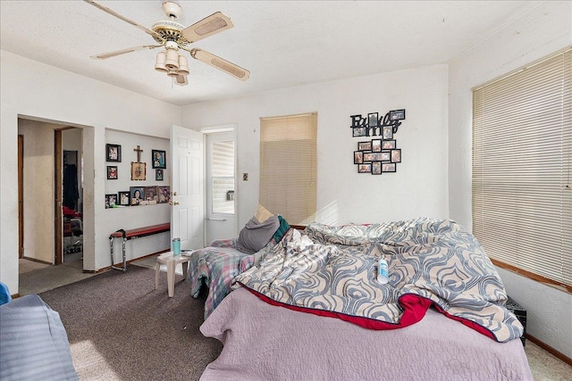carpeted bedroom with a ceiling fan