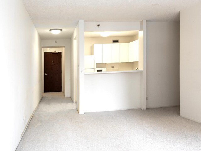 440 N Wabash St Unit 1807, Chicago, IL 60611 - unfurnished living room featuring visible vents and light colored carpet