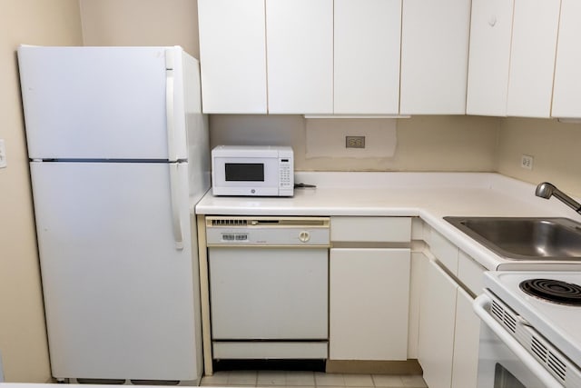 440 N Wabash St Unit 1807, Chicago, IL 60611 - kitchen featuring light countertops, a sink, white cabinets, and white appliances