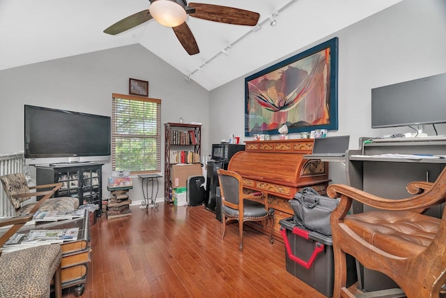 office space featuring vaulted ceiling, wood finished floors, ceiling fan, rail lighting, and baseboards