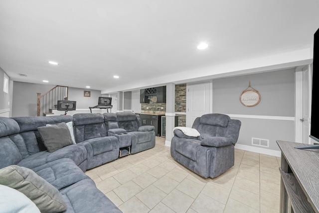 living room featuring stairs, light tile patterned floors, baseboards, visible vents, and recessed lighting