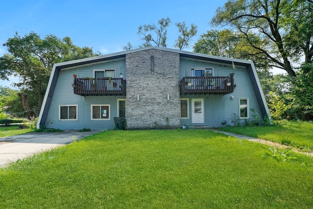 3917 Sunset Ave, Markham, IL 60428 - rear view of house with a balcony and a lawn