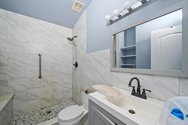 3917 Sunset Ave, Markham, IL 60428 - full bath with toilet, tiled shower, vanity, visible vents, and tile walls