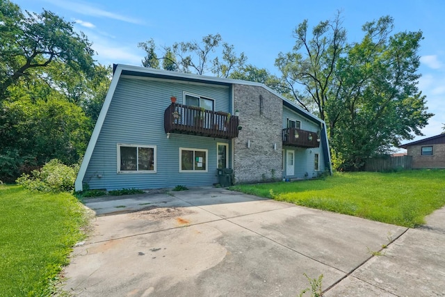 3917 Sunset Ave, Markham, IL 60428 - back of property with a balcony and a lawn