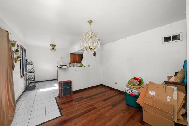 3917 Sunset Ave, Markham, IL 60428 - interior space featuring an inviting chandelier, wood finished floors, baseboards, and visible vents