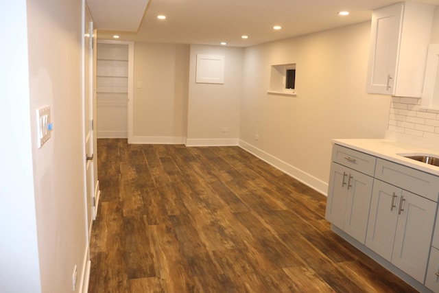 3418 N Nordica Ave, Chicago, IL 60634 - below grade area with dark wood-type flooring, baseboards, and recessed lighting