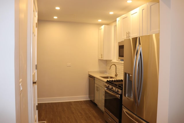 3418 N Nordica Ave, Chicago, IL 60634 - kitchen with baseboards, stainless steel appliances, a sink, dark wood-style floors, and backsplash