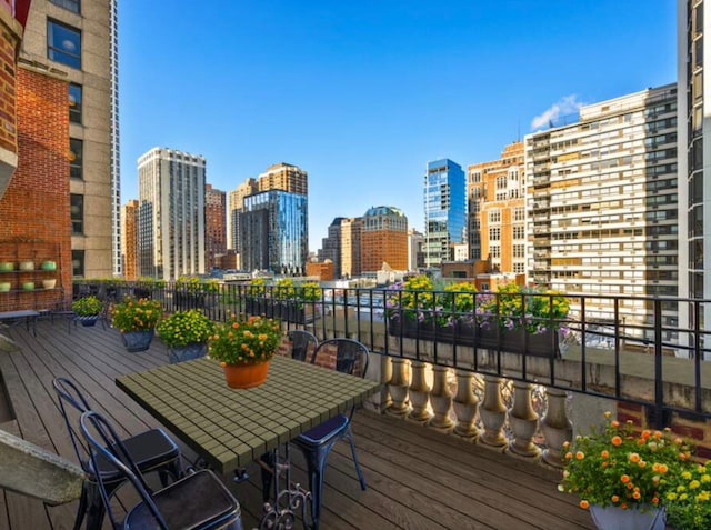wooden terrace with a city view