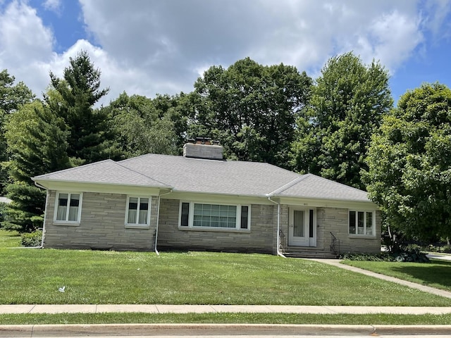 810 13th Ave, Mendota, IL 61342 - ranch-style home with stone siding, a front yard, and a chimney