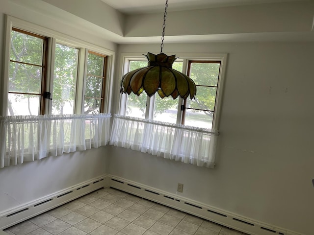 810 13th Ave, Mendota, IL 61342 - unfurnished dining area featuring baseboard heating, light tile patterned flooring, and healthy amount of natural light