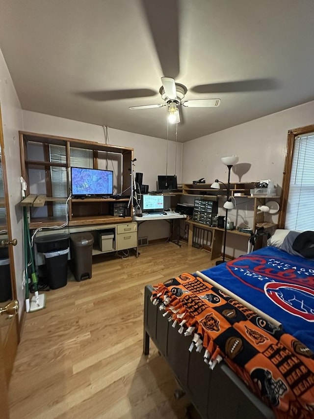 bedroom with light wood-style floors and ceiling fan