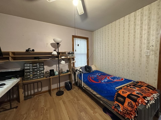 bedroom featuring wood finished floors