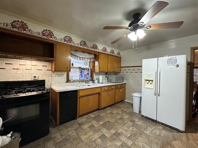 kitchen with light countertops, ceiling fan, a sink, black appliances, and brown cabinetry