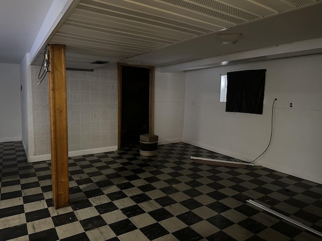 finished basement featuring tile patterned floors