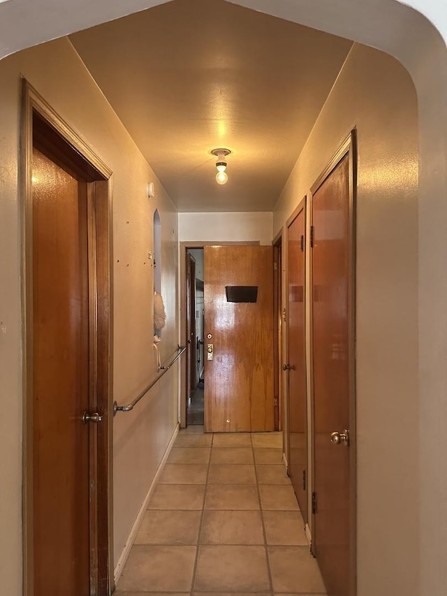 hallway with light tile patterned flooring