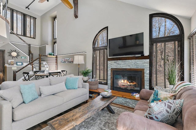 16 Oak Glen Dr, Galena, IL 61036 - living area featuring stairway, high vaulted ceiling, ceiling fan, a fireplace, and wood finished floors
