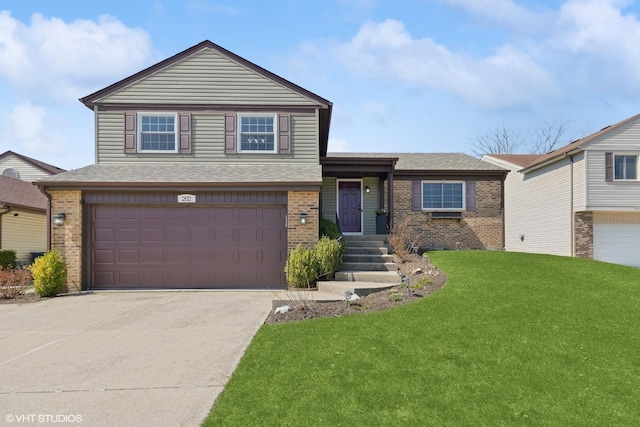 202 Albert Dr, Vernon Hills, IL 60061 - view of front facade featuring a front lawn, concrete driveway, brick siding, a garage, and a shingled roof