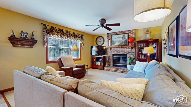 carpeted living area featuring baseboards, ceiling fan, and a brick fireplace