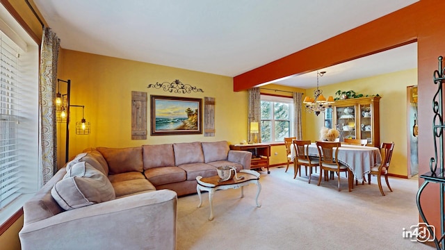 living room with carpet flooring, beam ceiling, a chandelier, and baseboards