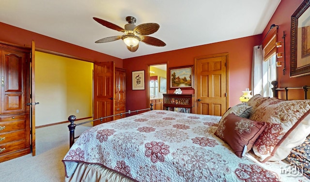 bedroom with baseboards, a ceiling fan, multiple windows, and carpet