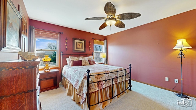 bedroom with baseboards, light carpet, and ceiling fan