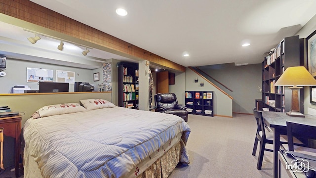 bedroom with recessed lighting, light carpet, and rail lighting
