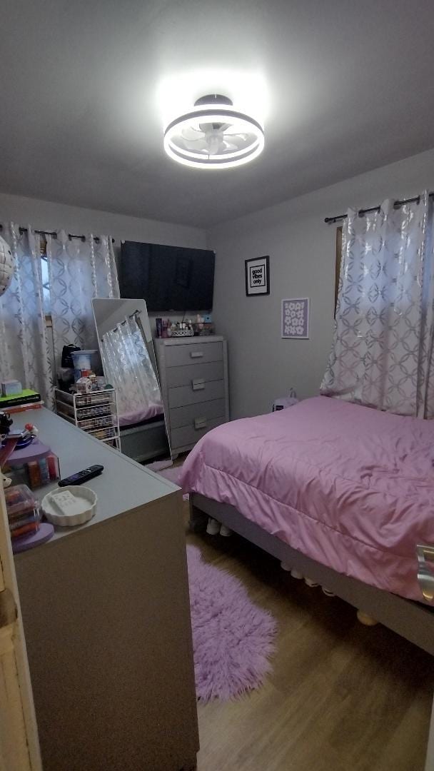 bedroom featuring wood finished floors