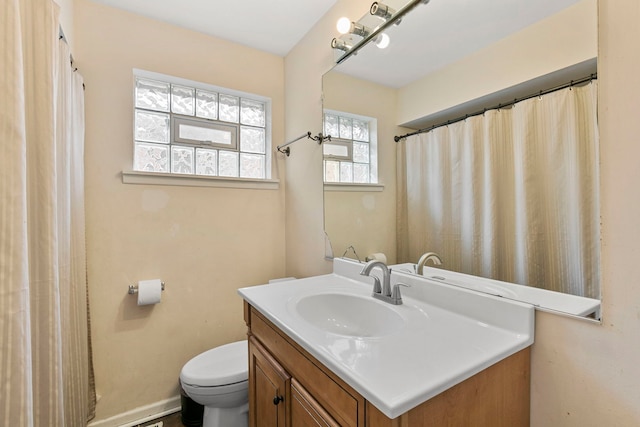 bathroom featuring vanity and toilet