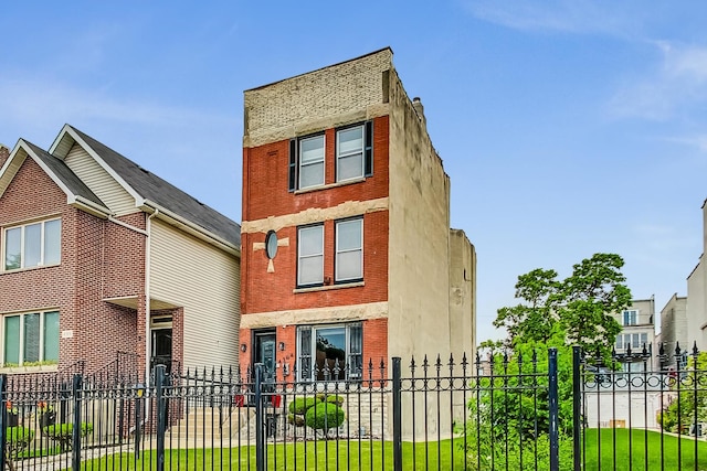 4364 S Oakenwald Ave, Chicago, IL 60653 - view of front facade featuring brick siding and a fenced front yard