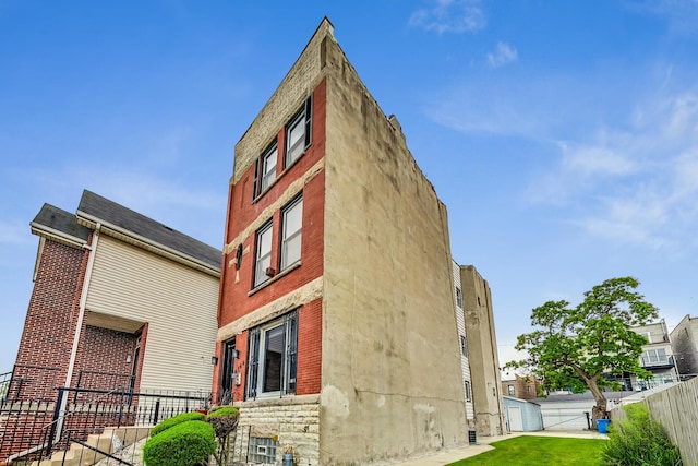 4364 S Oakenwald Ave, Chicago, IL 60653 - view of side of property with fence and brick siding